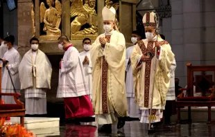 Cardinal Jose Advincula of Manila (right) is led to his cathedra inside the 
Manila Cathedral by Archbishop Charles Brown, papal nuncio to the 
Philippines, during the cardinal's installation as new prelate of the 
Archdiocese of Manila on June 24, 2021. Jose Torres Jr. / LiCAS News